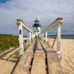 Brant Point Lighthouse at the entrance to Nantucket Harbor, seen from the boardwalk