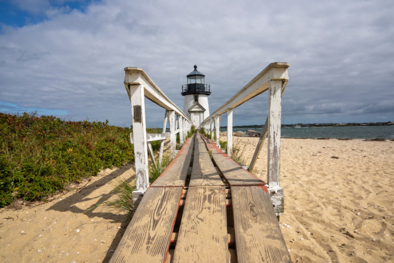 Brant Point Lighthouse at the entrance to Nantucket Harbor, seen from the boardwalk