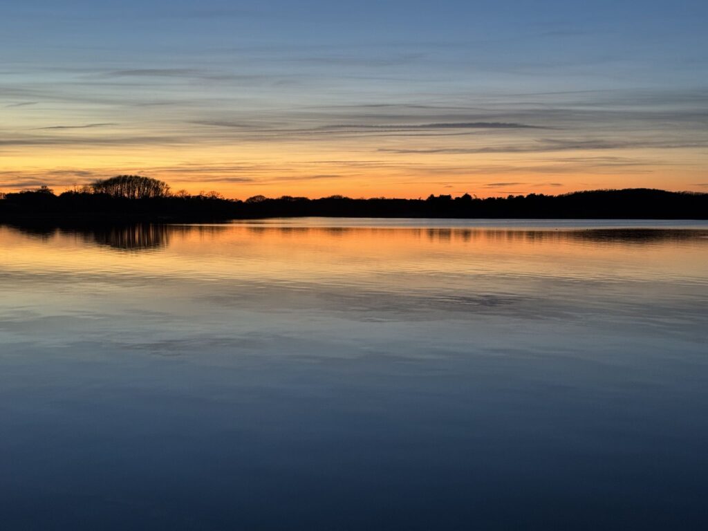 Nantucket sunset reflection Orange sunset reflected on a still Nantucket pond