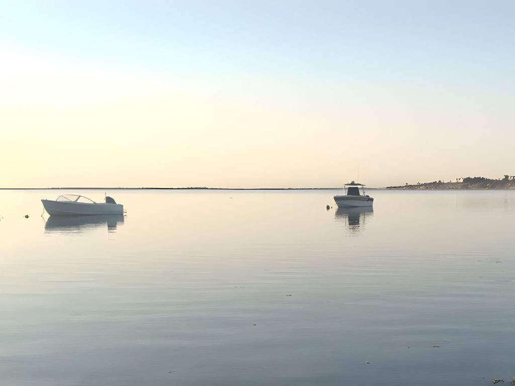 Boats in Polpis Harbor (4:3) Two boats moored on calm water in Polpis Harbor, Nantucket, at dawn